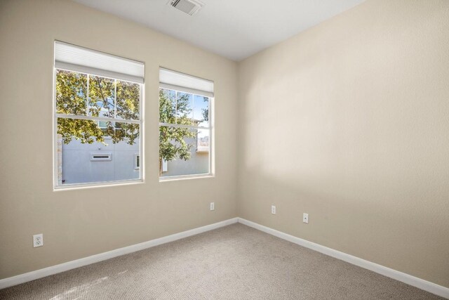 spare room featuring carpet flooring