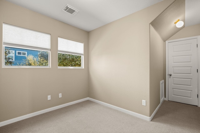 spare room with light colored carpet