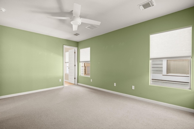 unfurnished room featuring carpet flooring and ceiling fan