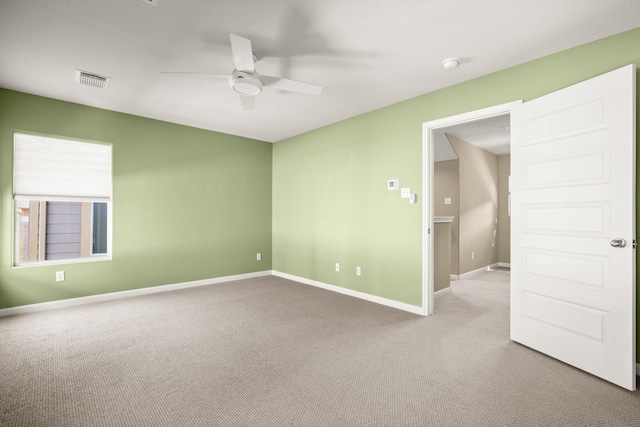 unfurnished room with light carpet and ceiling fan