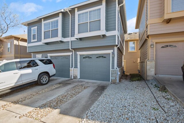 townhome / multi-family property featuring a garage