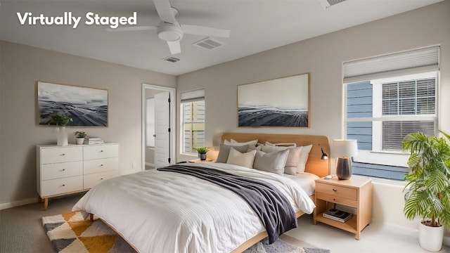 bedroom featuring ceiling fan, carpet floors, visible vents, and baseboards