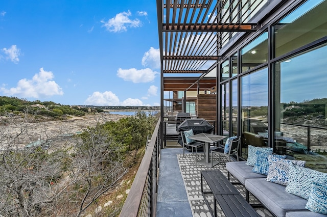 exterior space with a grill and a water view