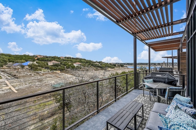 balcony with a grill and a water view