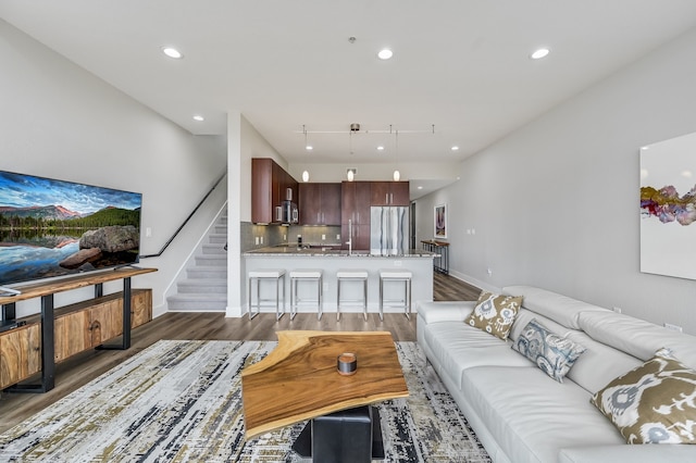 living room with dark hardwood / wood-style floors