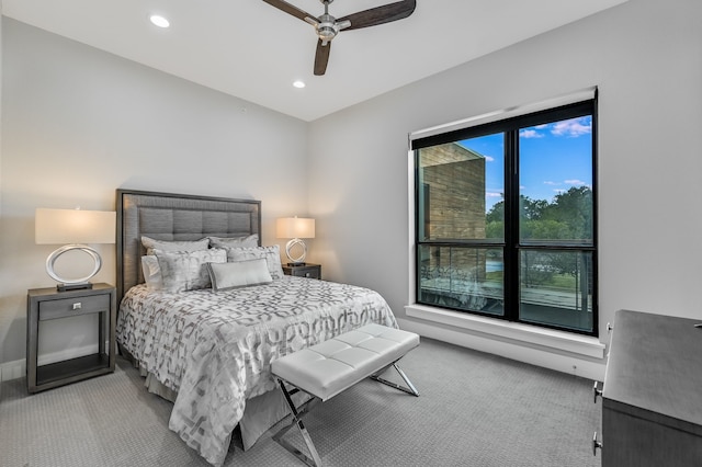 bedroom with ceiling fan and carpet flooring