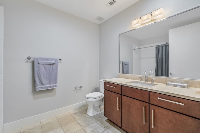 bathroom featuring toilet, a shower with shower curtain, tile patterned flooring, and vanity