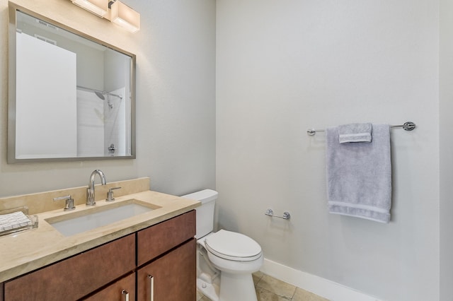 bathroom featuring toilet, walk in shower, tile patterned floors, and vanity