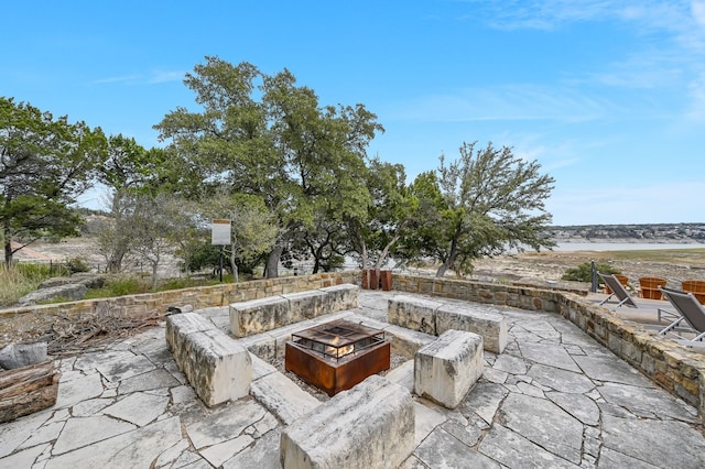 view of patio featuring a fire pit