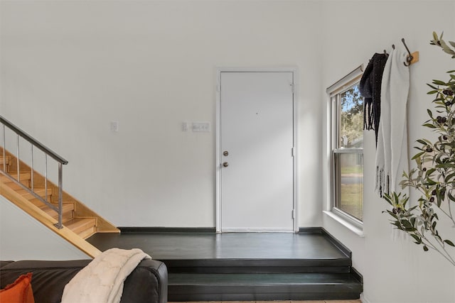 staircase with plenty of natural light