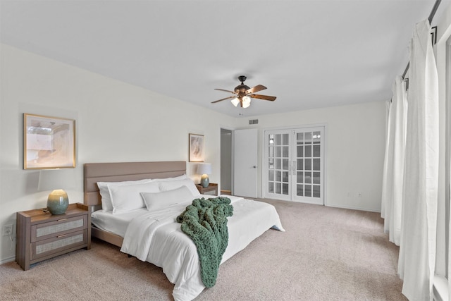 bedroom with ceiling fan and light colored carpet