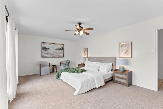 bedroom with light carpet and ceiling fan