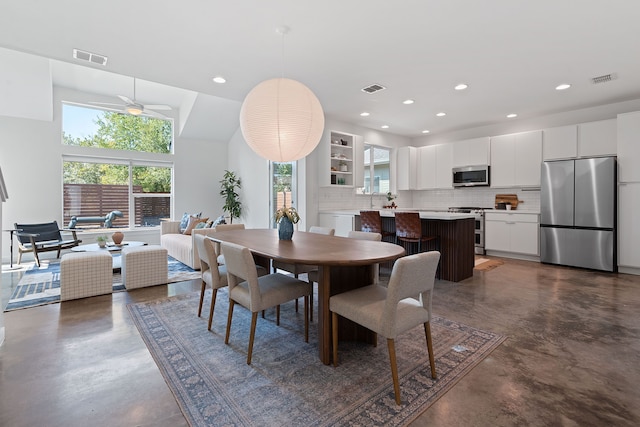 dining space featuring ceiling fan