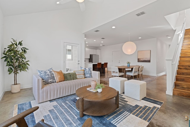 living room featuring concrete floors and ceiling fan