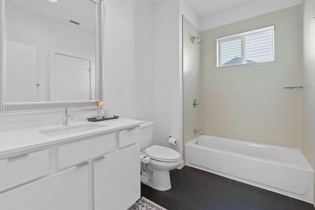 full bathroom featuring toilet, vanity, and tiled shower / bath