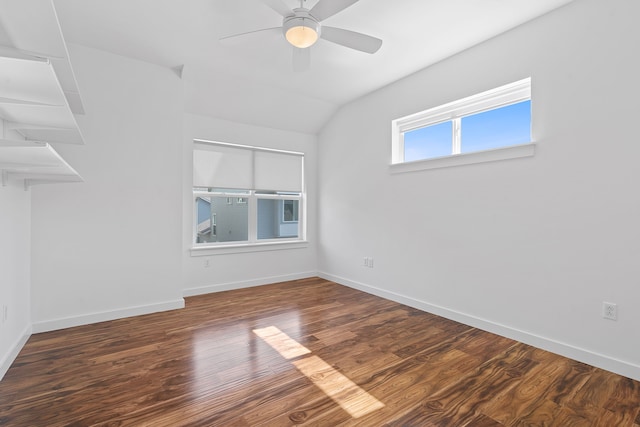 empty room featuring ceiling fan, dark hardwood / wood-style flooring, and lofted ceiling