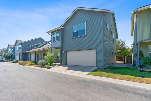 view of front of home featuring a front yard and a garage