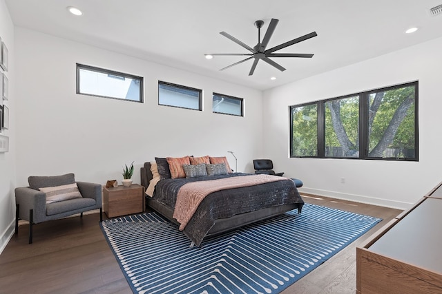 bedroom with recessed lighting, visible vents, dark wood-type flooring, a ceiling fan, and baseboards