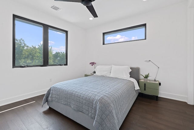 bedroom featuring recessed lighting, wood finished floors, a ceiling fan, visible vents, and baseboards