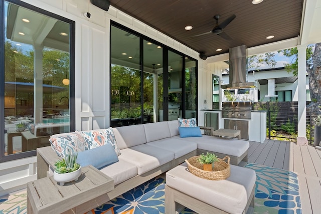 deck with a grill, ceiling fan, and an outdoor hangout area