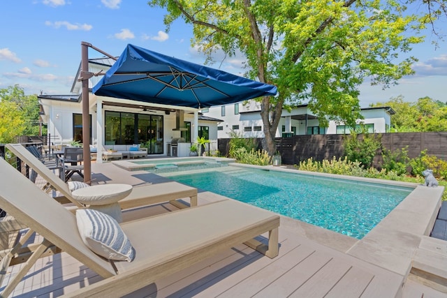 view of swimming pool with a patio, outdoor lounge area, fence, and a ceiling fan