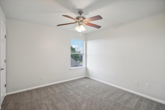 spare room featuring ceiling fan and carpet floors