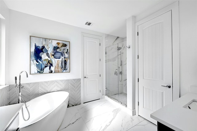 bathroom featuring tile walls, a baseboard radiator, vanity, and shower with separate bathtub