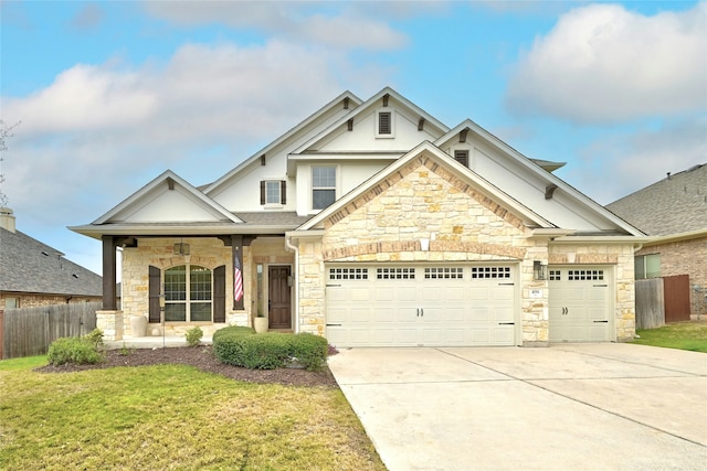 craftsman-style home featuring a garage, a porch, and a front lawn