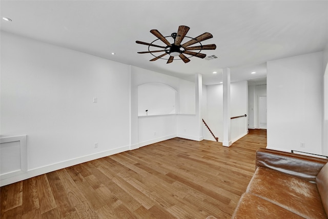 unfurnished room with ceiling fan and light hardwood / wood-style flooring