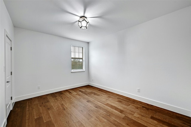 unfurnished room featuring wood-type flooring