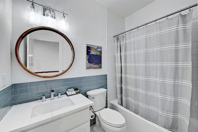 full bathroom with toilet, shower / bath combo, vanity, and tile walls