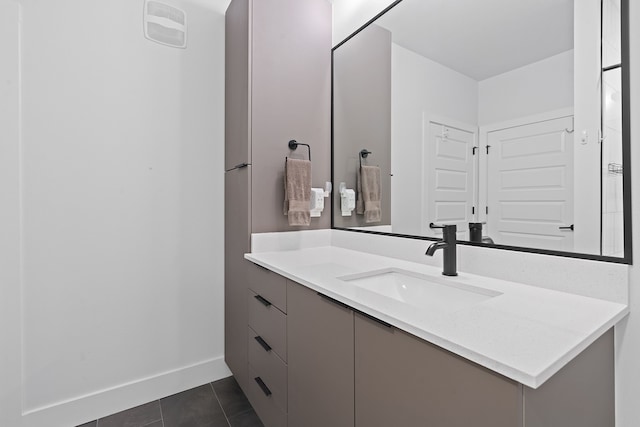 bathroom with tile patterned floors and vanity