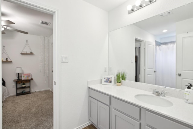 bathroom with ceiling fan and vanity