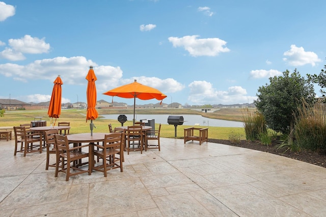 view of patio / terrace with a water view