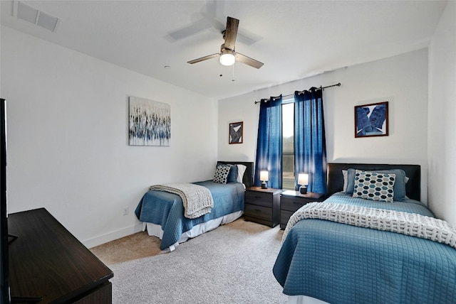 bedroom with baseboards, ceiling fan, visible vents, and light colored carpet