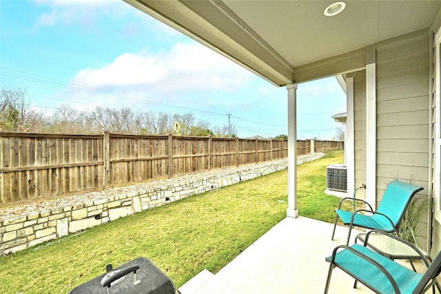 view of yard featuring a fenced backyard, cooling unit, and a patio