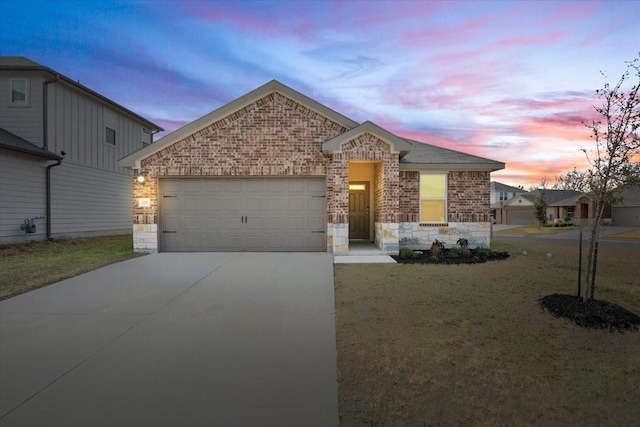 view of front facade with a lawn and a garage