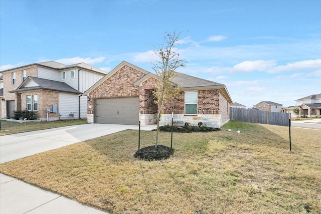 view of front of home featuring a front yard and a garage