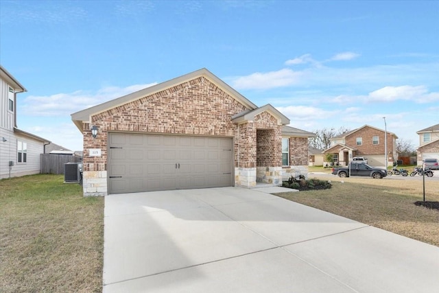 view of front of house featuring a front lawn, central AC, and a garage