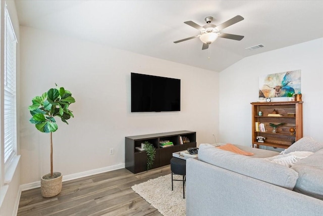 living room featuring lofted ceiling, ceiling fan, and hardwood / wood-style floors