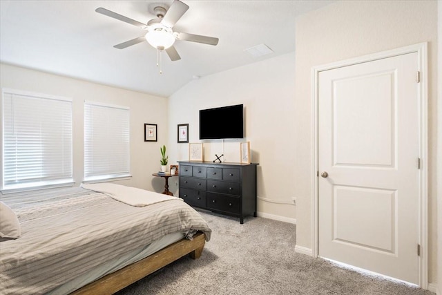 bedroom featuring lofted ceiling, light colored carpet, and ceiling fan