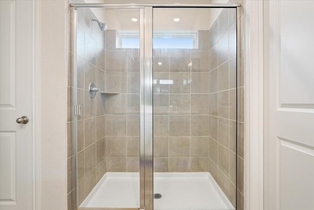 bathroom featuring an enclosed shower