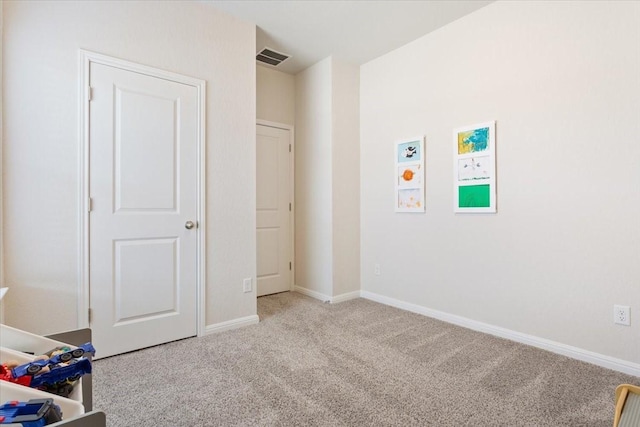 unfurnished bedroom featuring light colored carpet