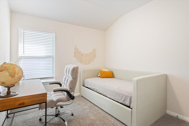 carpeted bedroom featuring lofted ceiling