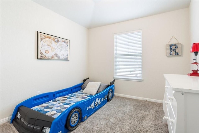 bedroom featuring multiple windows and light colored carpet