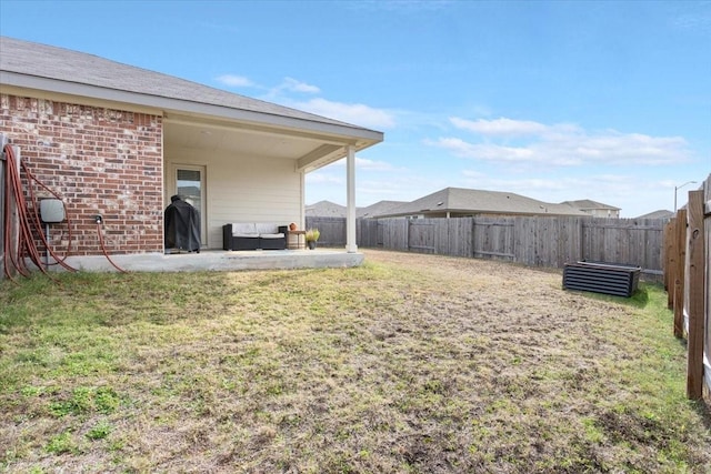 view of yard with a patio area and an outdoor living space