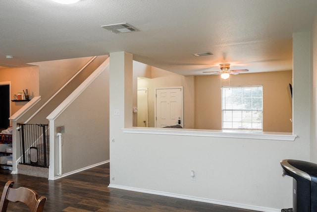 living room with ceiling fan and dark hardwood / wood-style floors