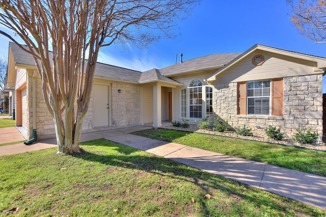 single story home featuring a garage and a front yard