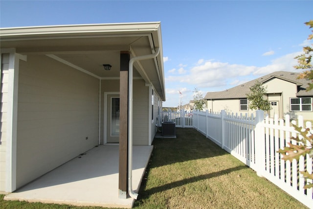 view of yard featuring a patio area and central AC unit