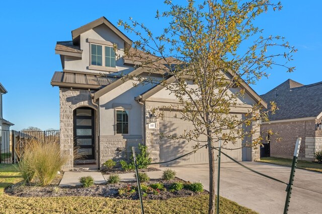 117 Dycus Bnd, Liberty Hill, TX 78642 - traditional-style home with driveway, stucco siding, stone siding, metal roof, and a garage